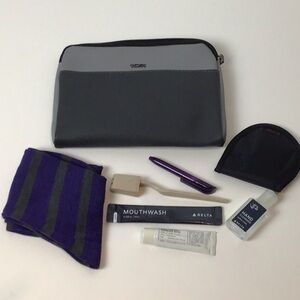 Almost complete Tumi amenities bag.